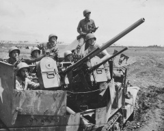 834th Anti-Aircraft Artillery 37mm Halftrack and Thompson Gunner Okinawa.jpg